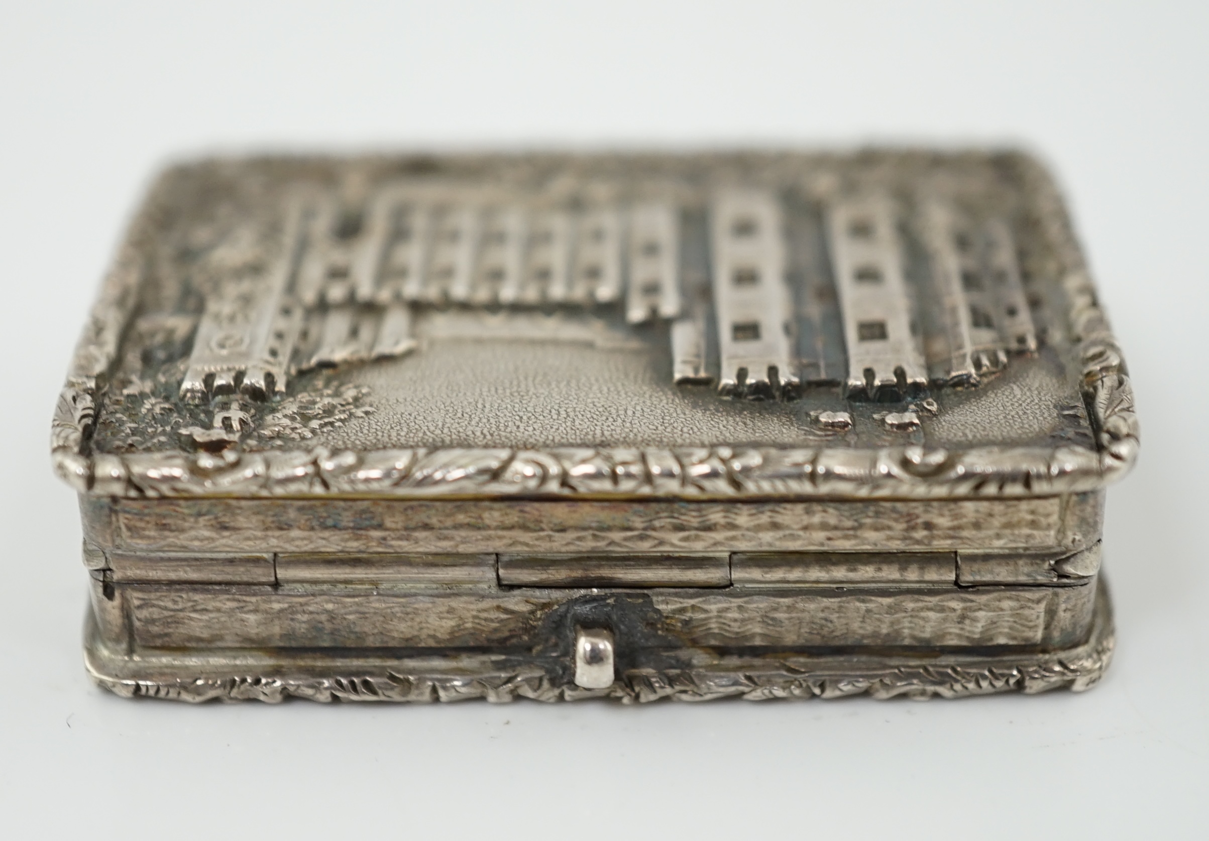 A George IV engine turned silver castle top rectangular vinaigrette, by Francis Clark, depicting ‘Kenilworth Castle’ in relief